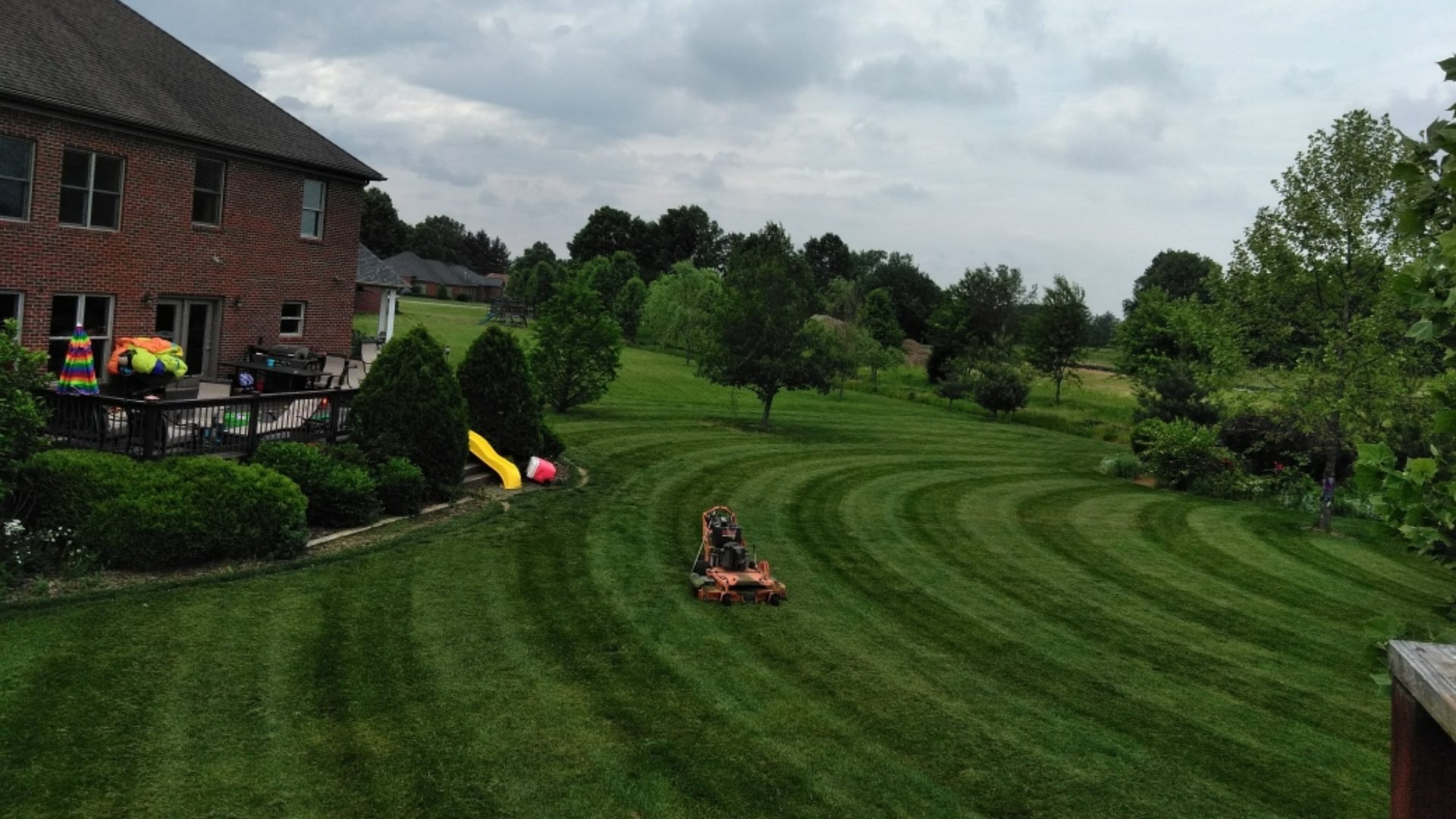 Higher view of freshly mowed lawn with half circle pattern lines in Prospect, KY.