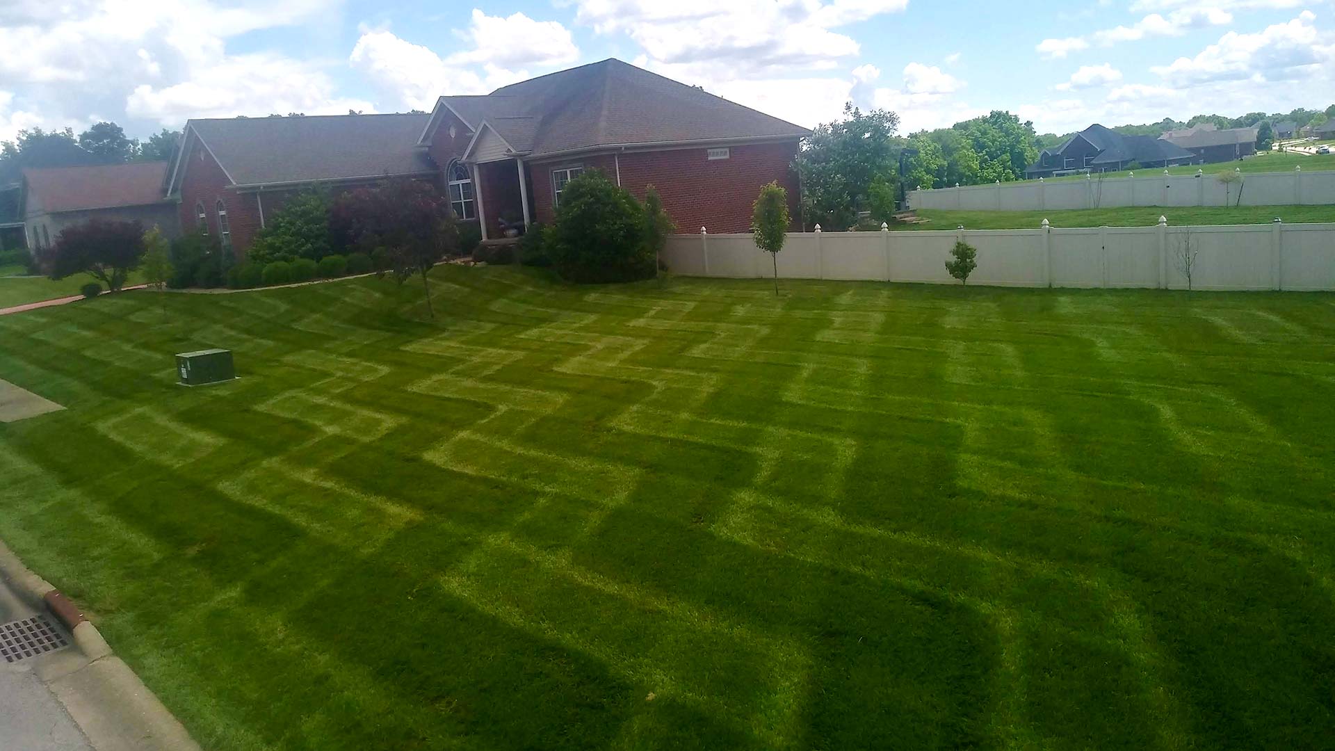 L-shaped mowing lines at a home in Sellersburg, IN.