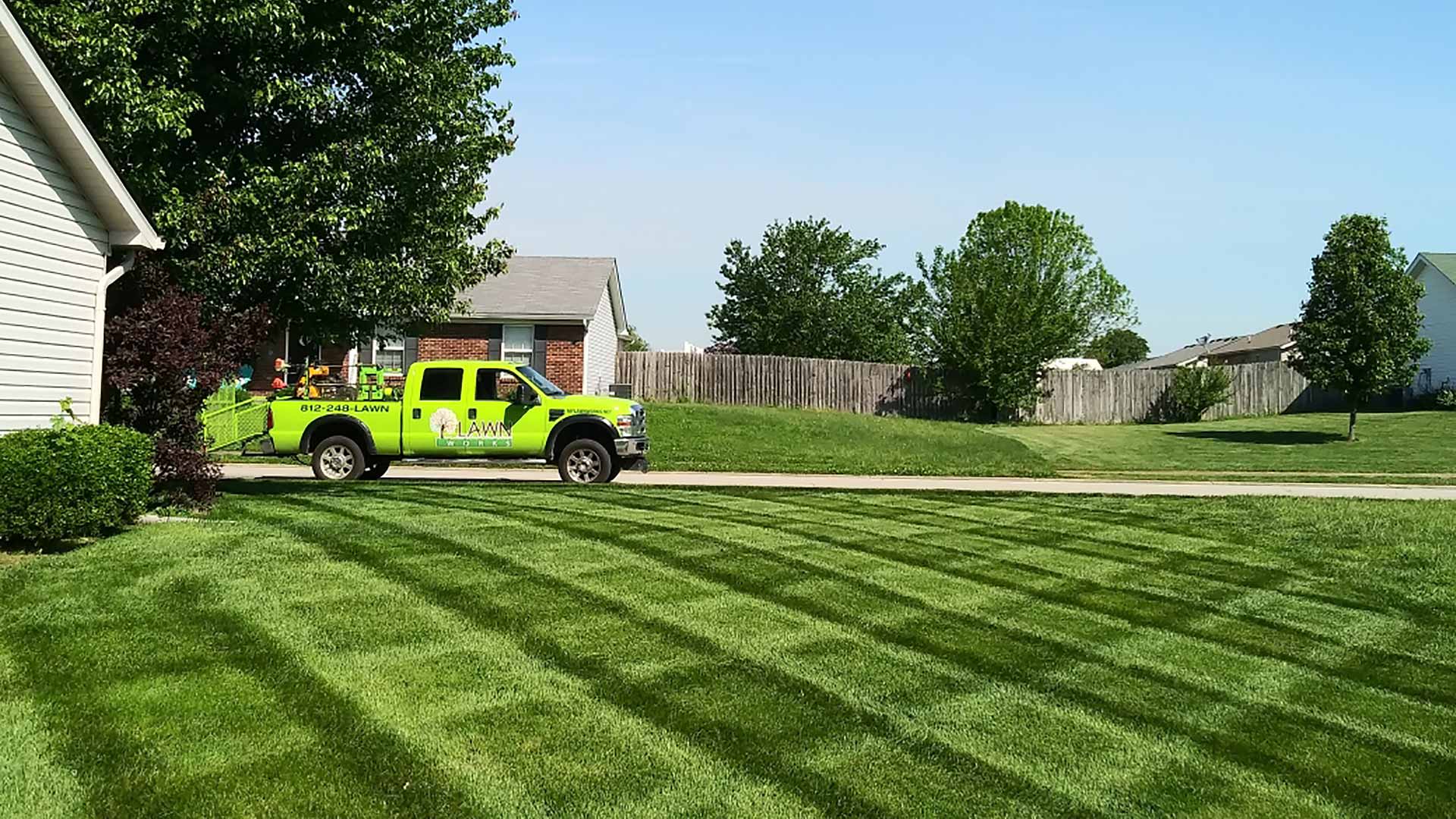 Lawn Works work truck at a property in Jeffersonville, IN.