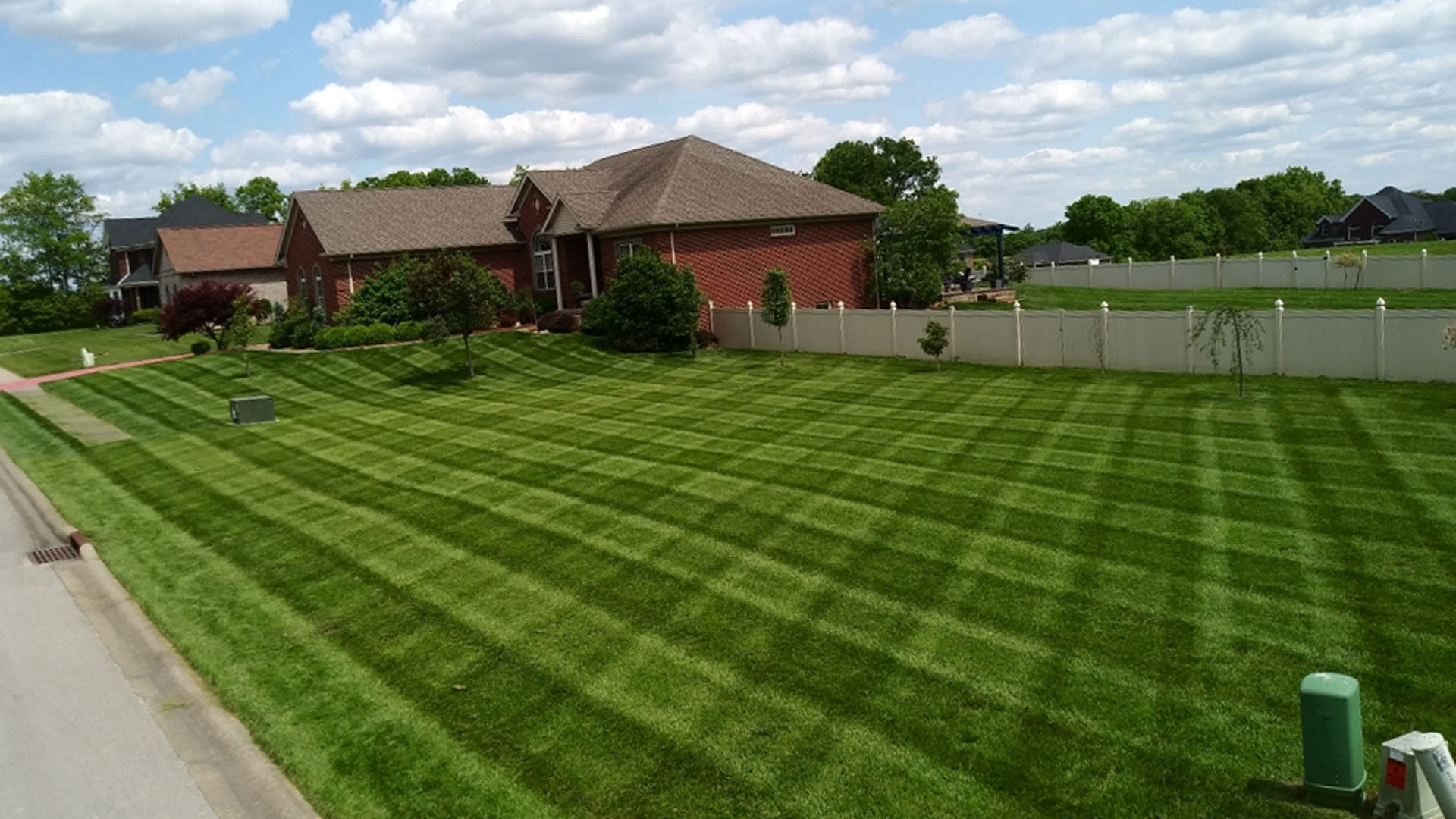 Square lawn patterns after mowing service in Shively, KY.