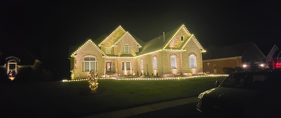 Christmas lighting installed around home in Plantation, KY.
