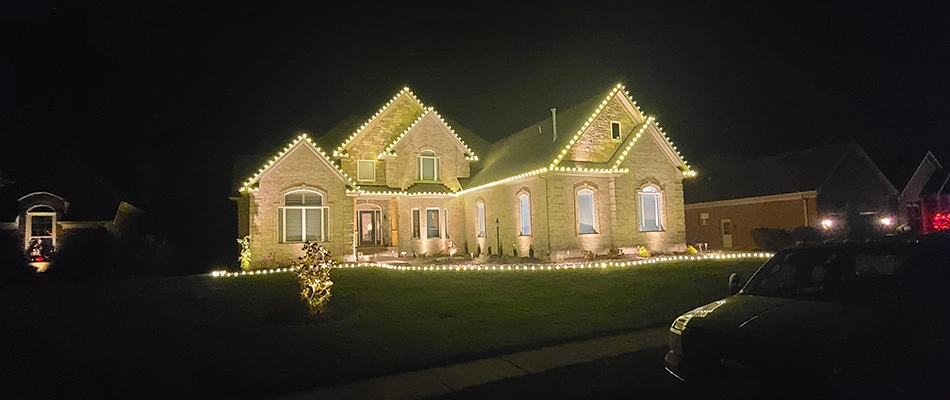 Christmas lighting installed around home in Plantation, KY.