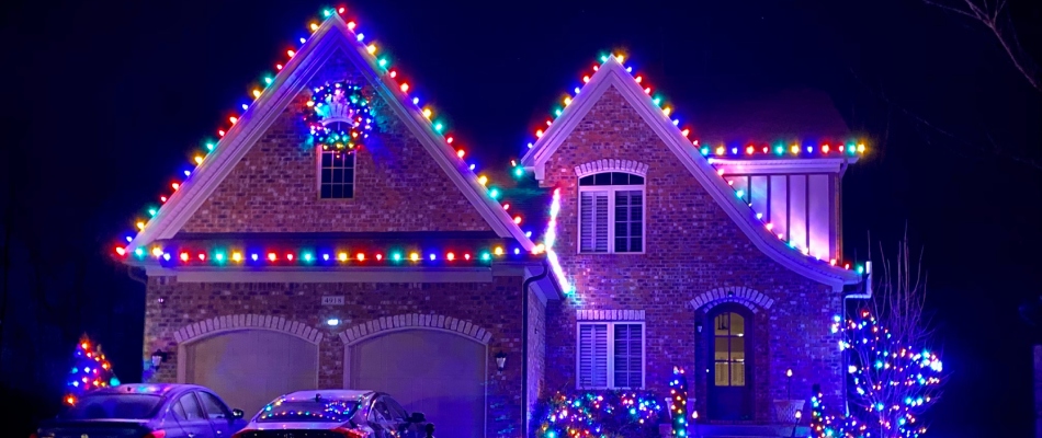 Holiday lighting added to home by lawn works workers in Clark County, IN.