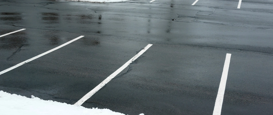 Parking lot cleared of snow from commercial snow removal service in Worthington, KY.